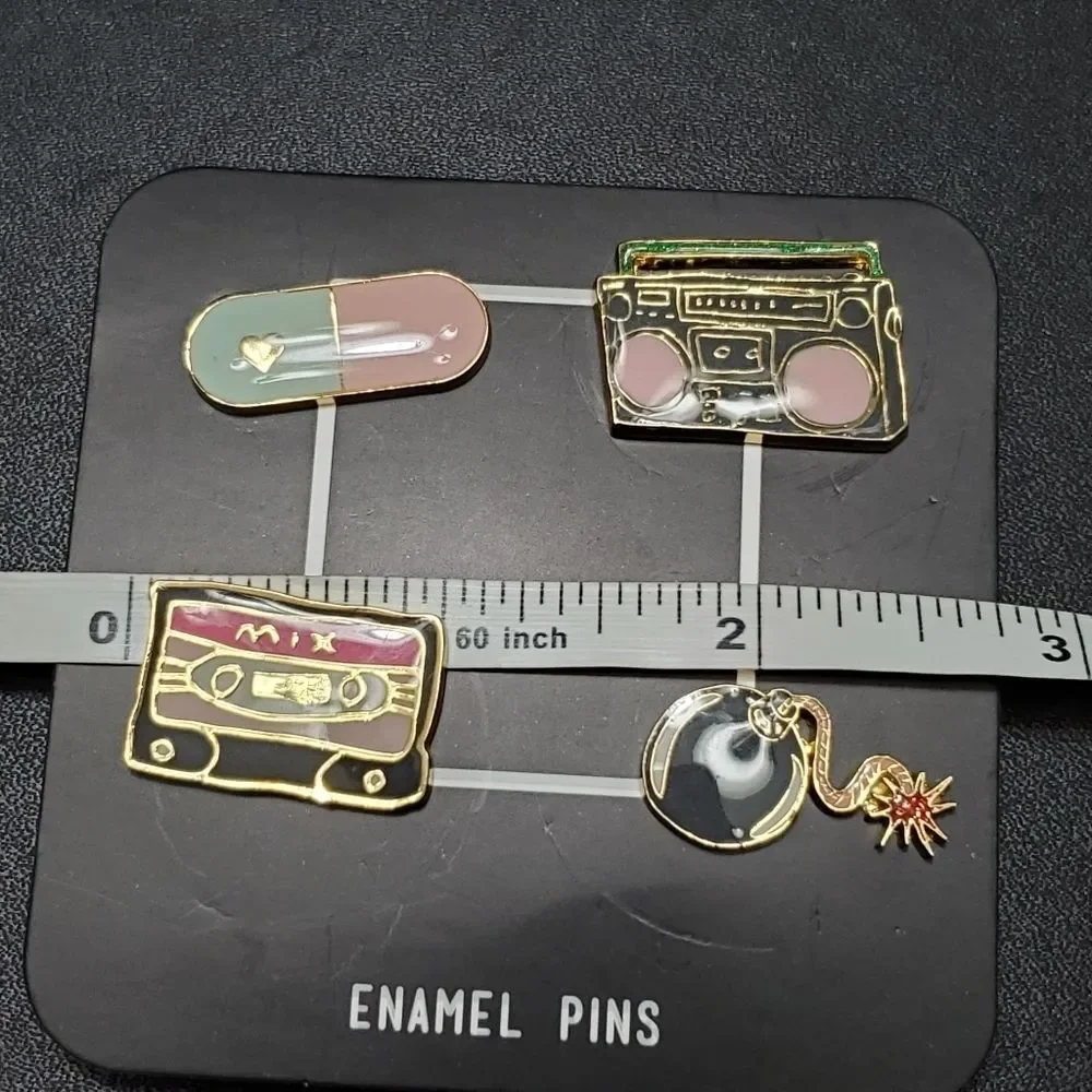 Gold tone set of 4 enamel pins